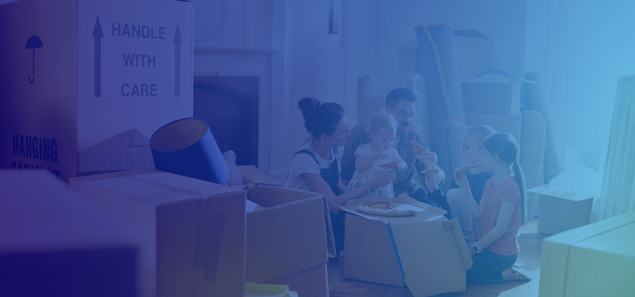 Happy family unpacking boxes in new home, child playing in box, symbolizing a stress-free move with Canadian Preferred Moving