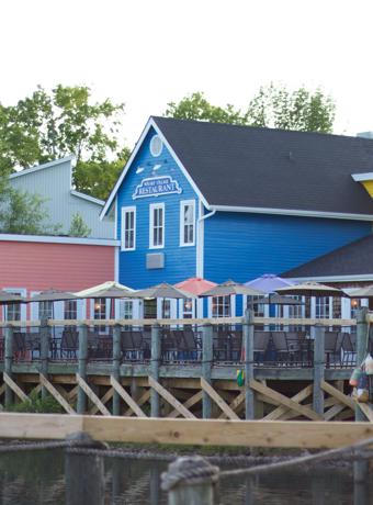 Colorful waterfront houses at a serene Moncton location reflecting Canadian Preferred Moving's local presence.