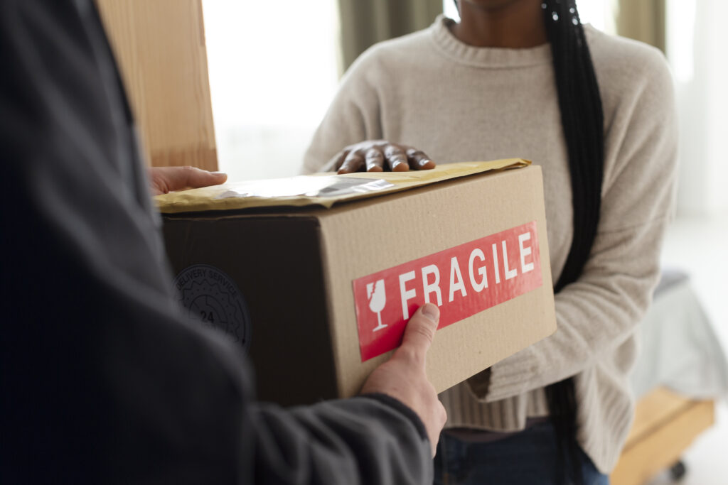 Professional movers and packers handling fragile items