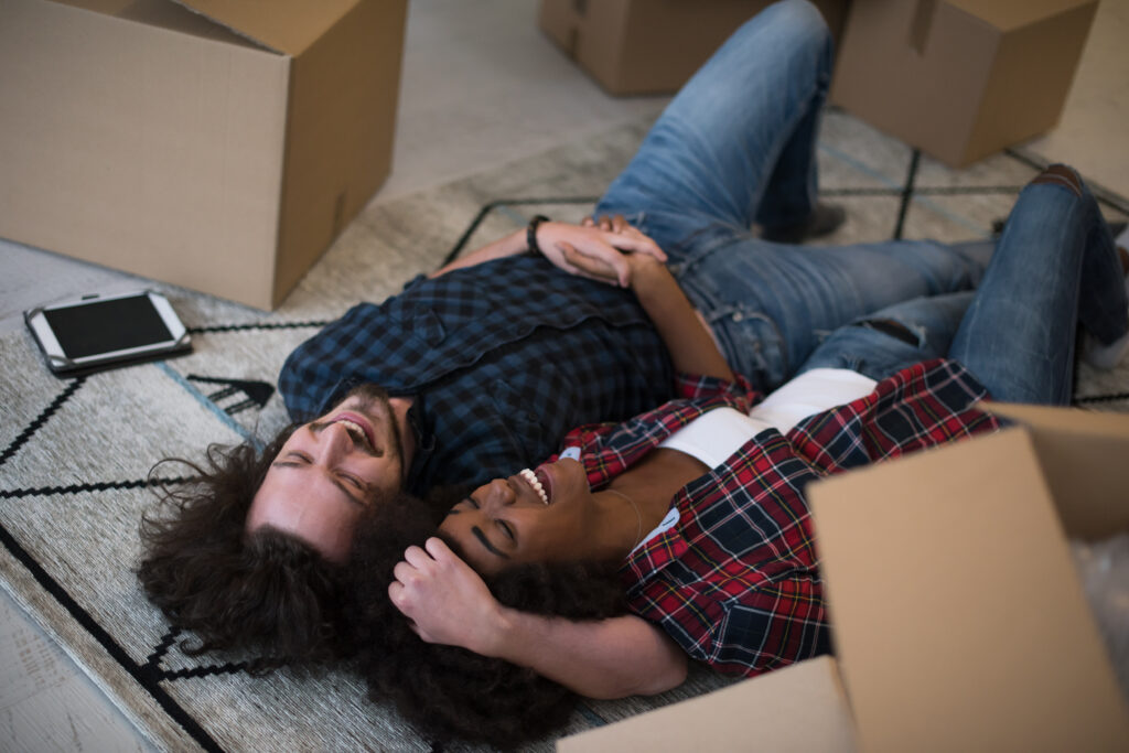 Smiling couple relieved after selecting full-value moving protection
