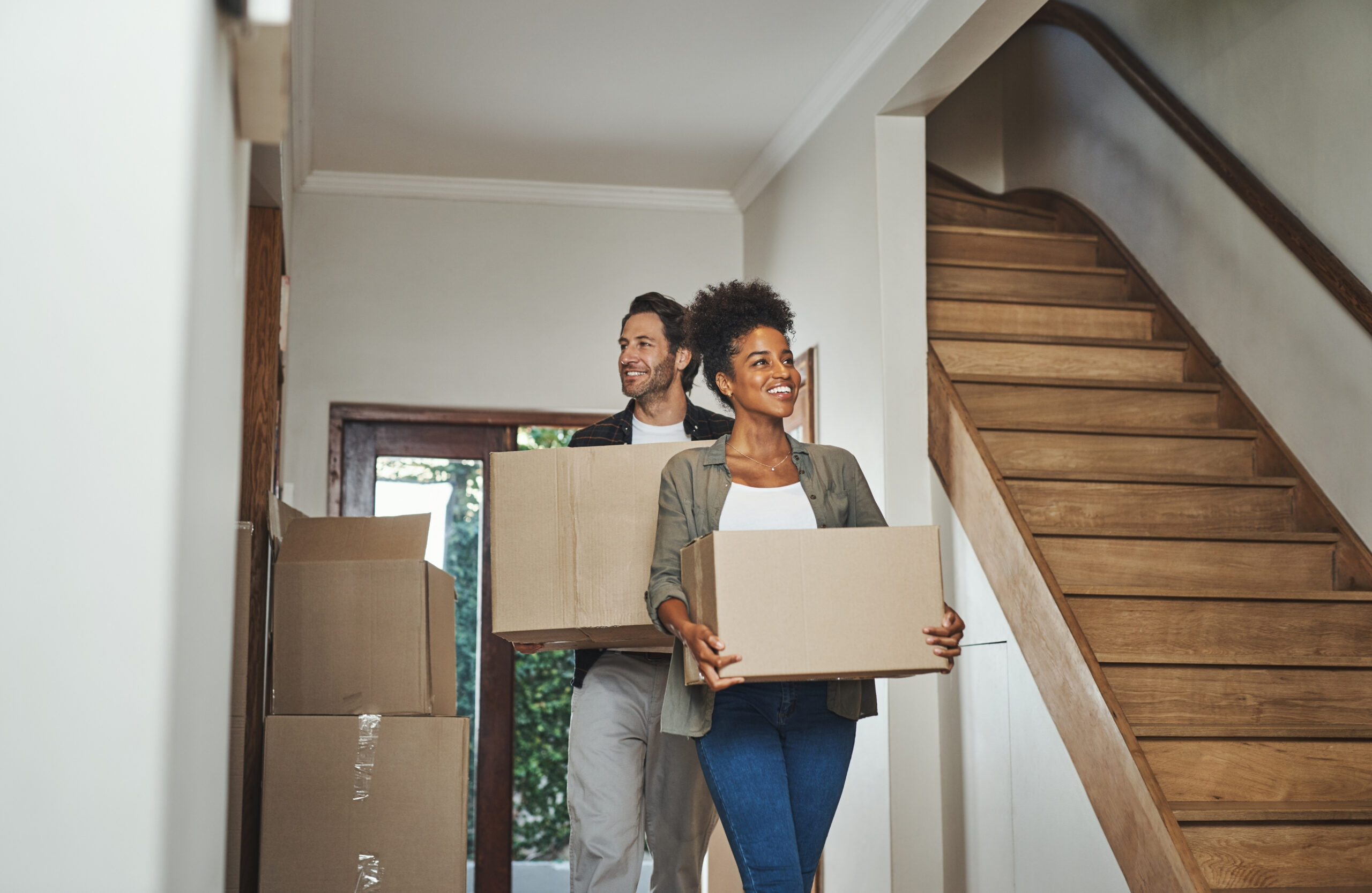 Family packing boxes for a cross-border move from Canada to the US