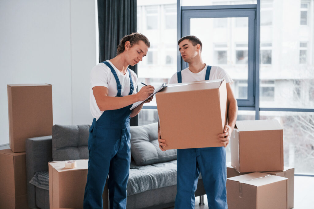 Professional movers from CPM packing and organizing moving boxes