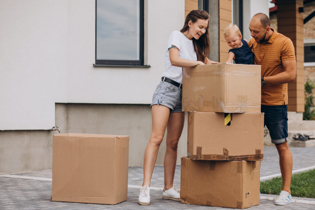 Happy family unpacking in their new US home