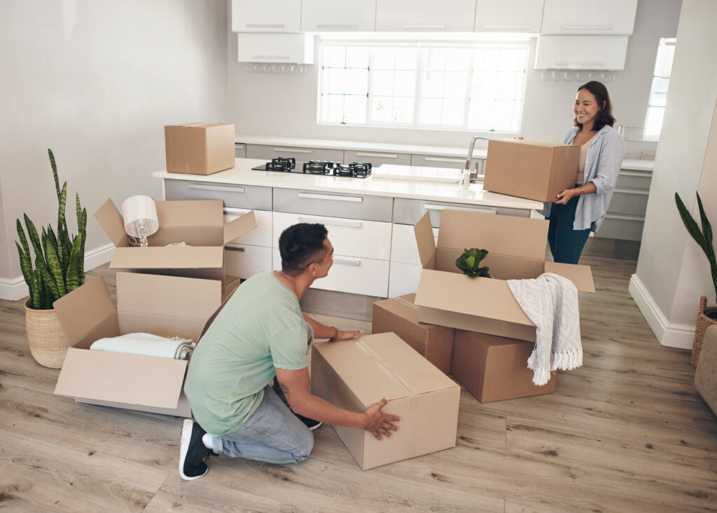 Young couple moving into their new home.