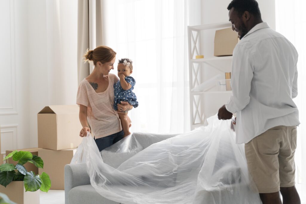 couple and their daughter getting ready to move