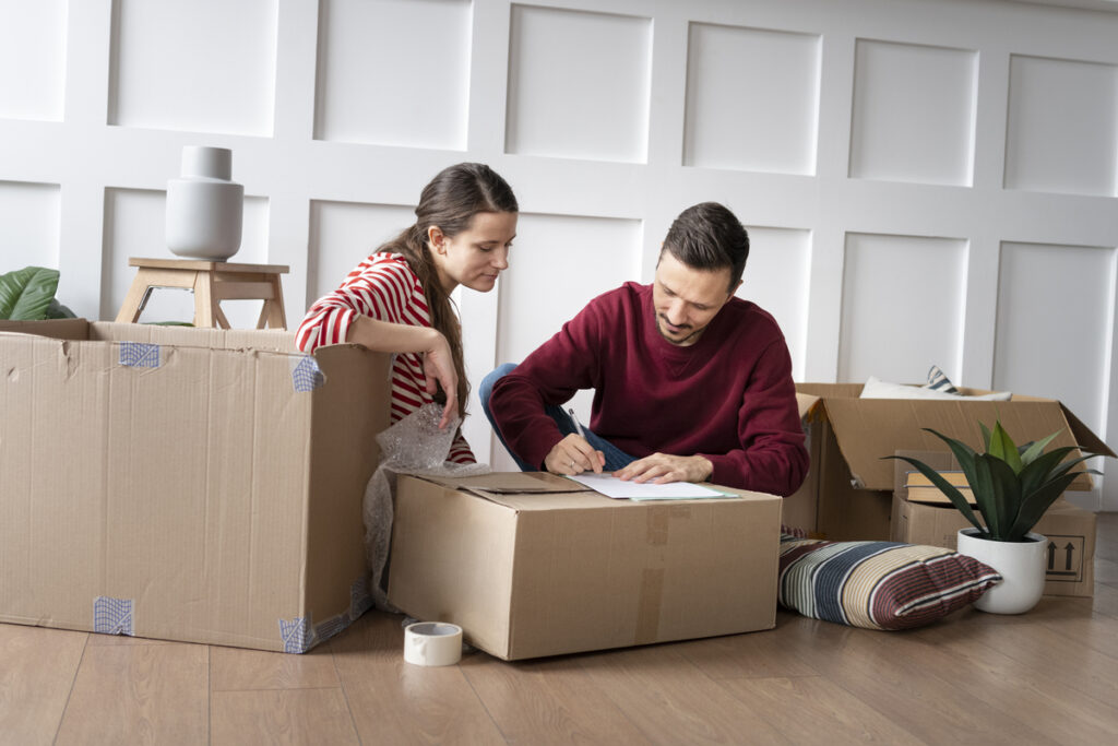 Young couple budgeting for their move in Canada